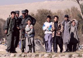 Boys and policemen in Kabul